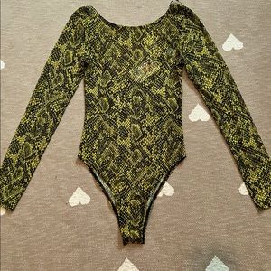 yellow and black patterned body suit from h&m a little see through